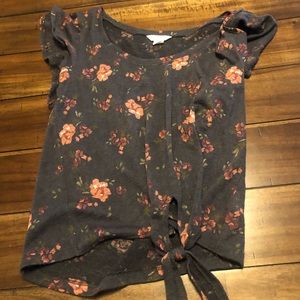 Gray Shortsleeve shirt with flowers.